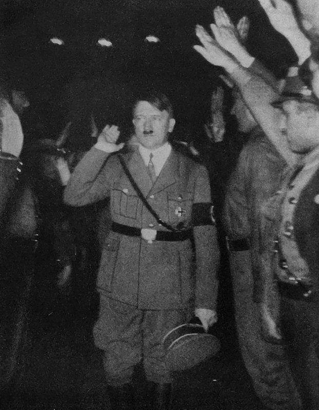 Adolf Hitler greets party members in Munich's Hofbräuhaus for the 14th anniversary of the Parteigründungsfeier (creation of the NSDAP)